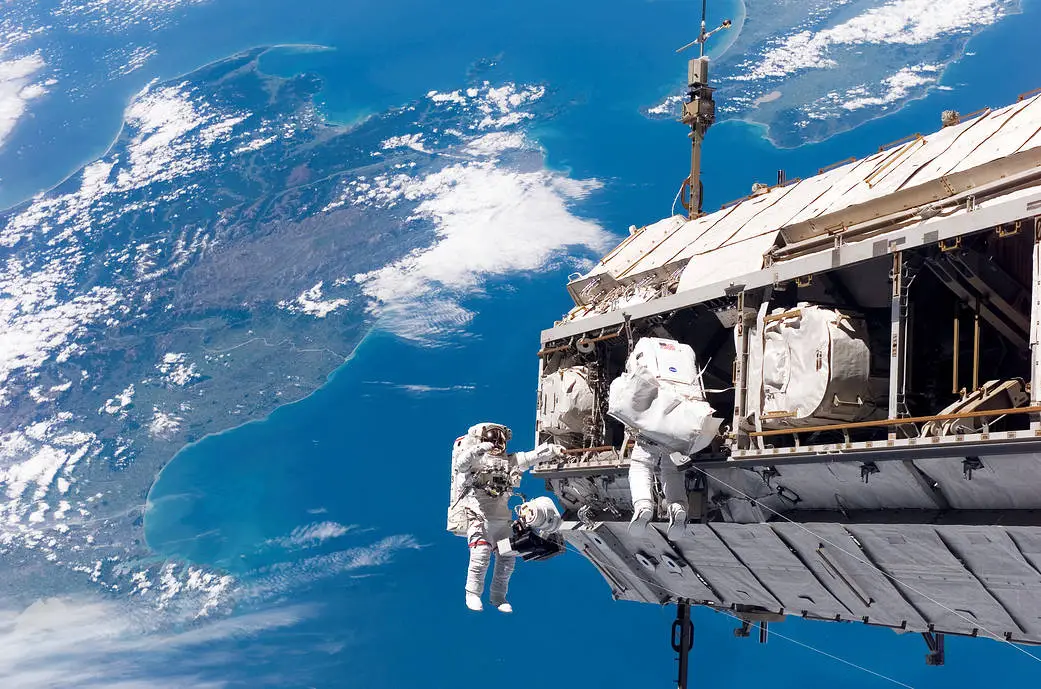 Astronaut spacewalk with Earth in the background